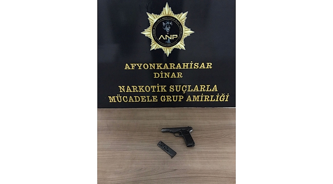 dinar da aranan sahis tabanca ile yakalandi
